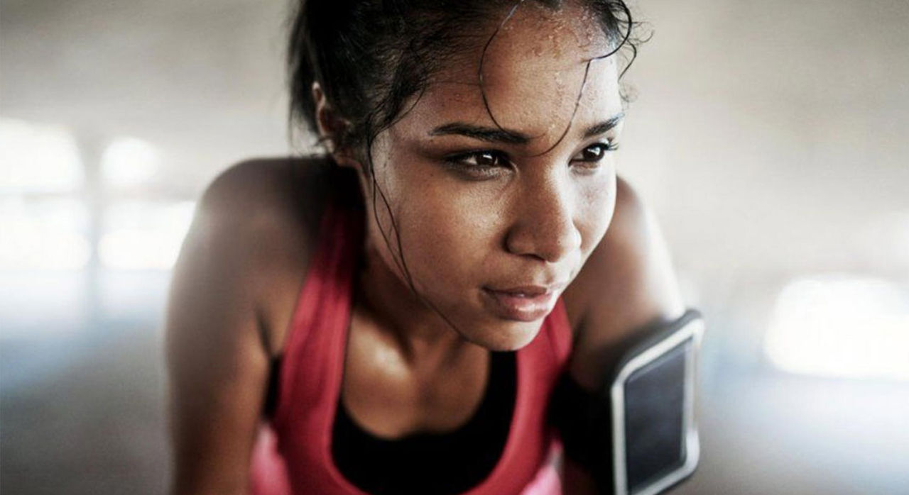 woman athlete catching a breath after a rigorous workout