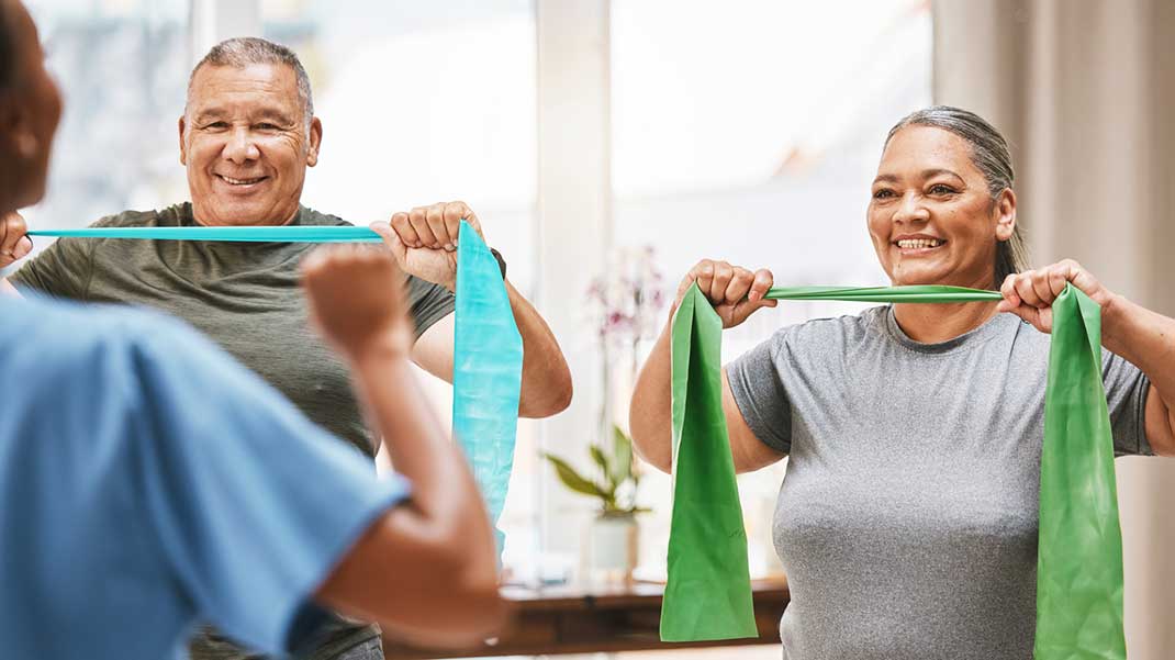 Patients doing band exercises for Parkinson’s disease.