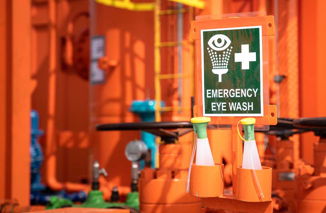 An emergency eye wash station in an industrial workplace.