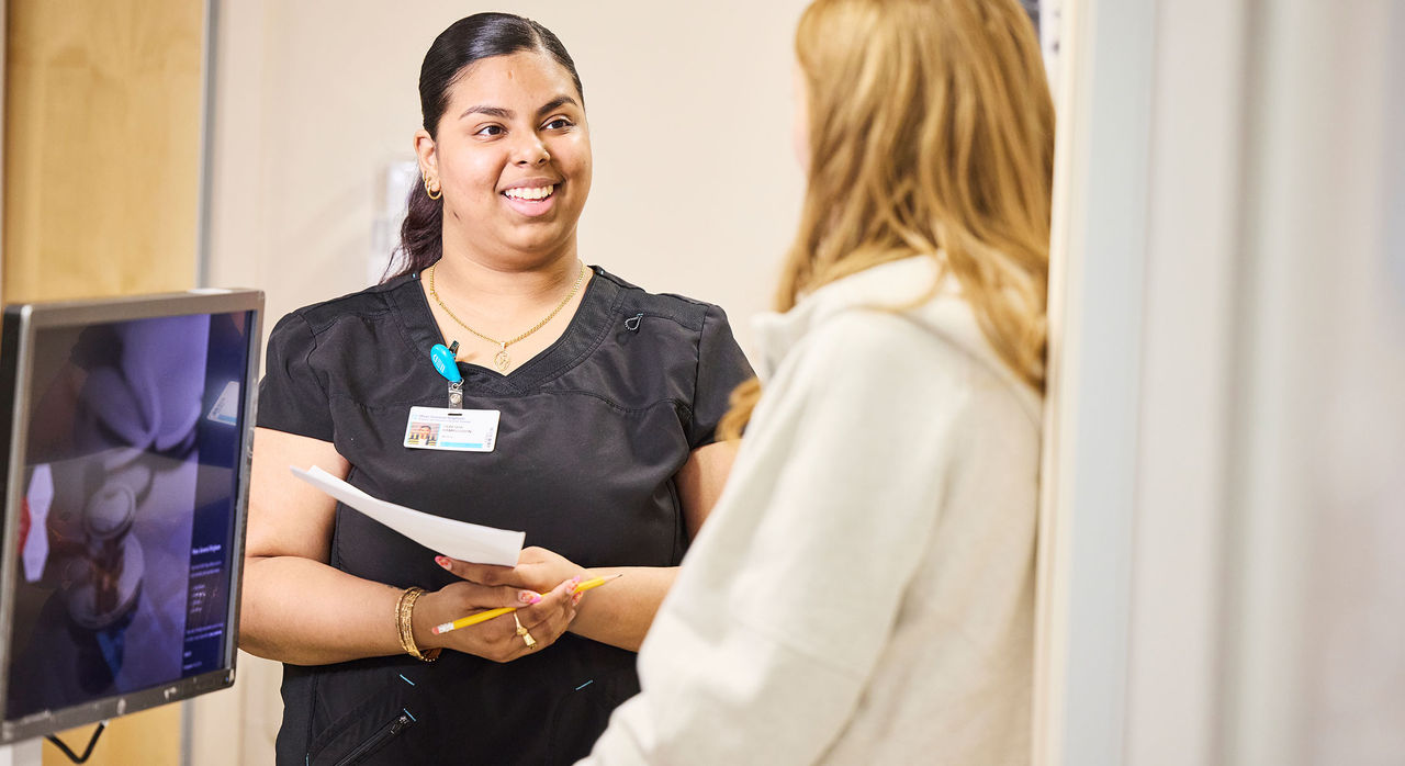 a female provider speaks with a patient.