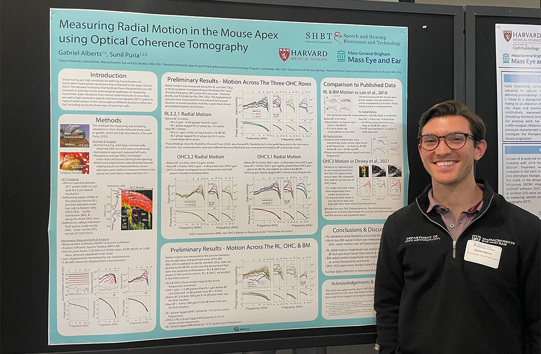 Gabriel Alberts displaying a research poster at the Mass Eye & Ear Research Day 2023.