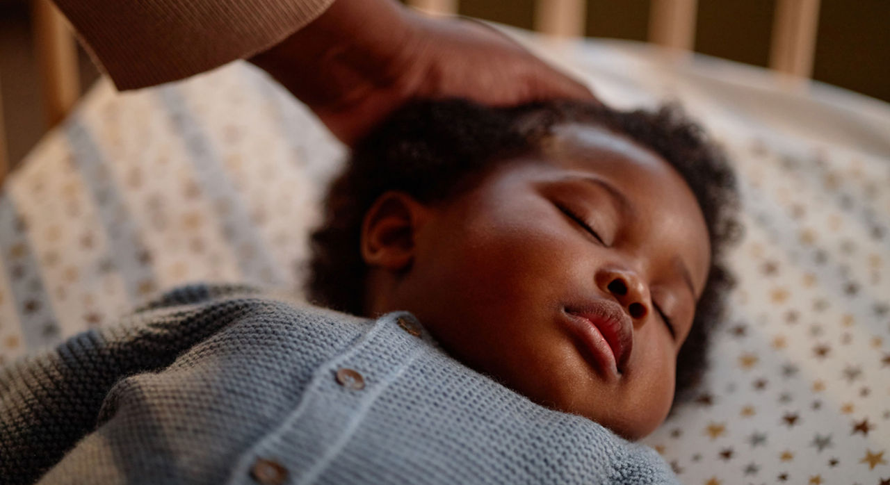 Parent places baby to sleep on his back in his crib to help reduce risk of SUID.