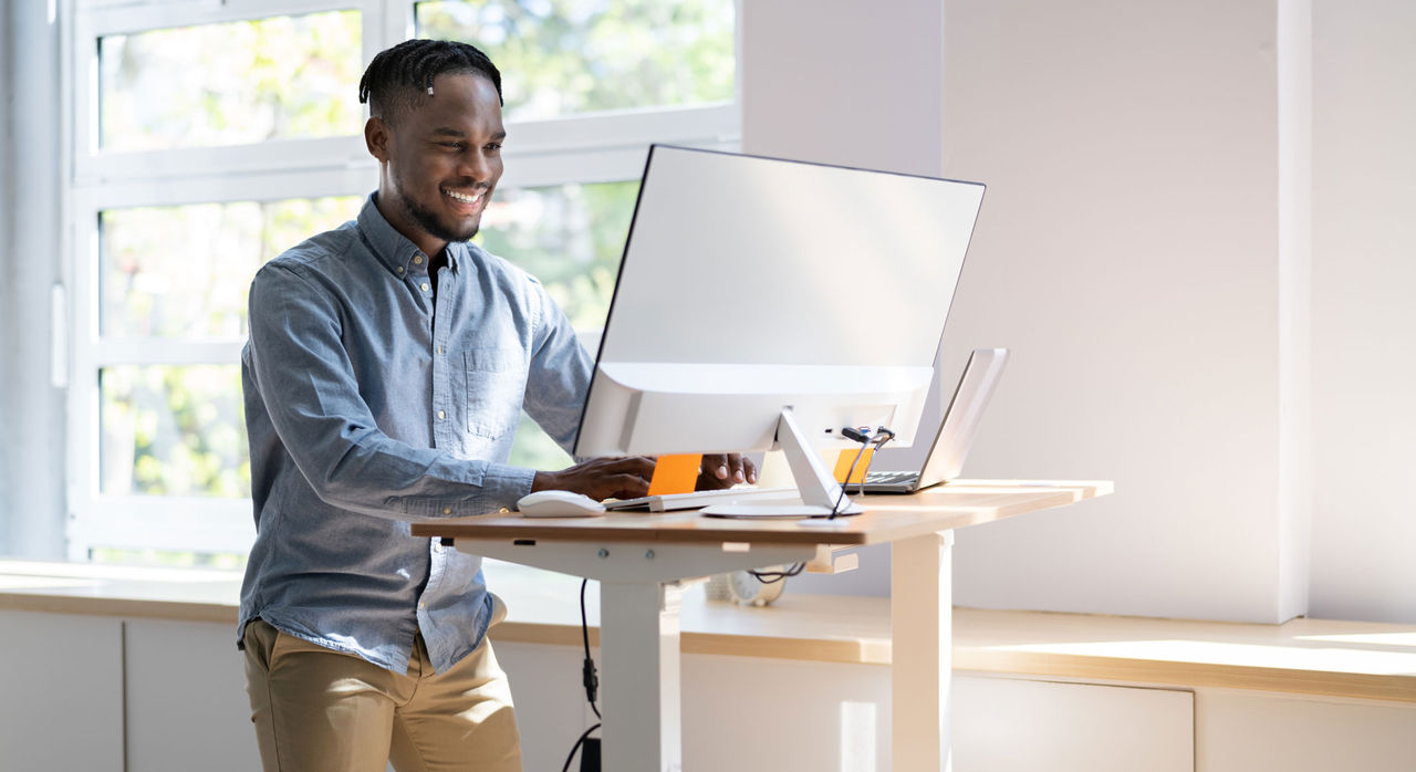 Man working at a standing desk