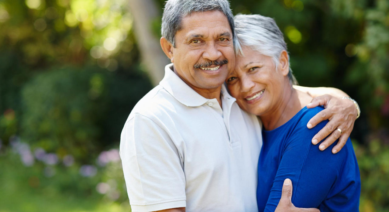 Older man and woman embracing