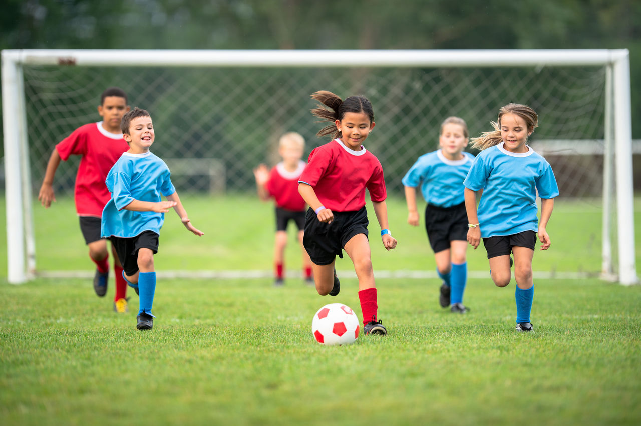 Children playing youth soccer.