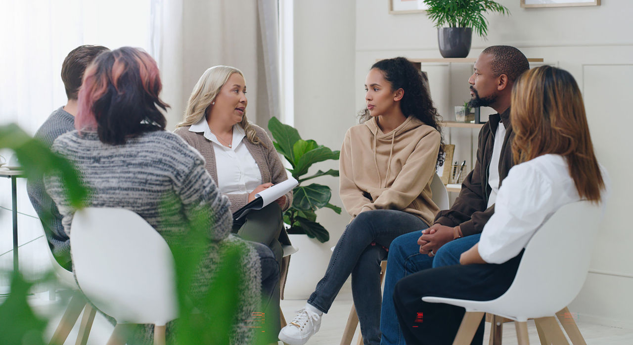 A support group meets and discusses together