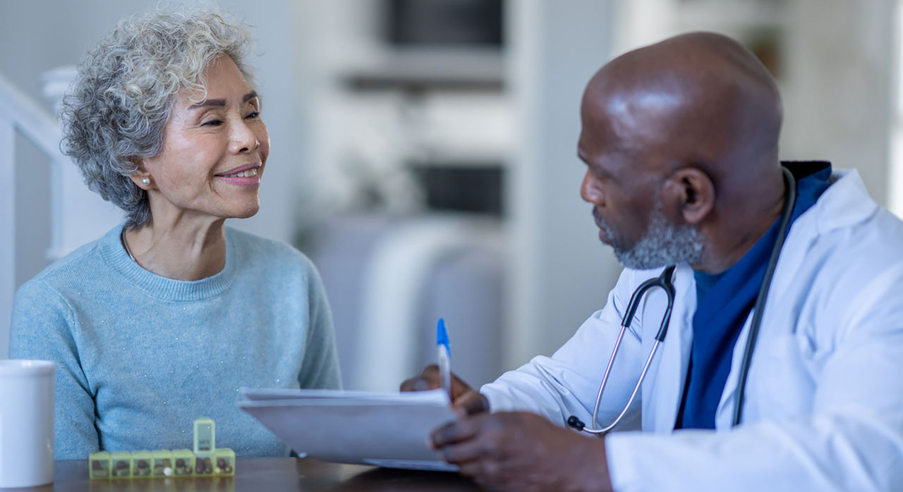 Cardiologist speaks with a patient.