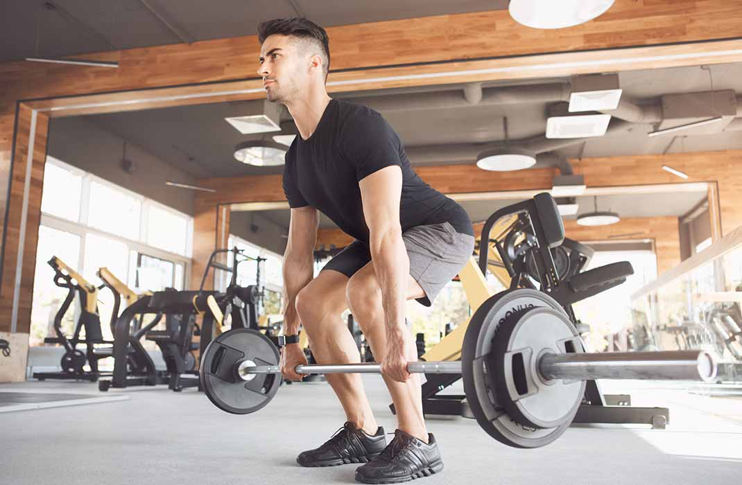 A male athlete practices weightlifting