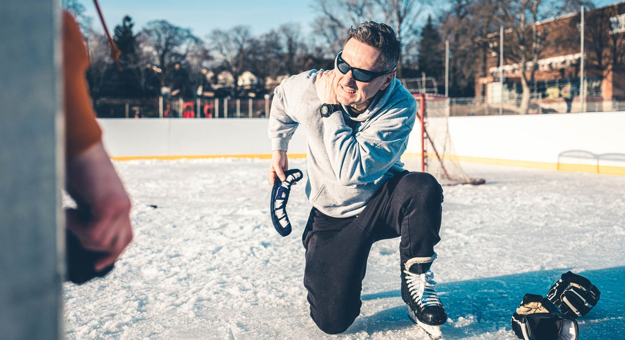 A man with shoulder injury during hockey game