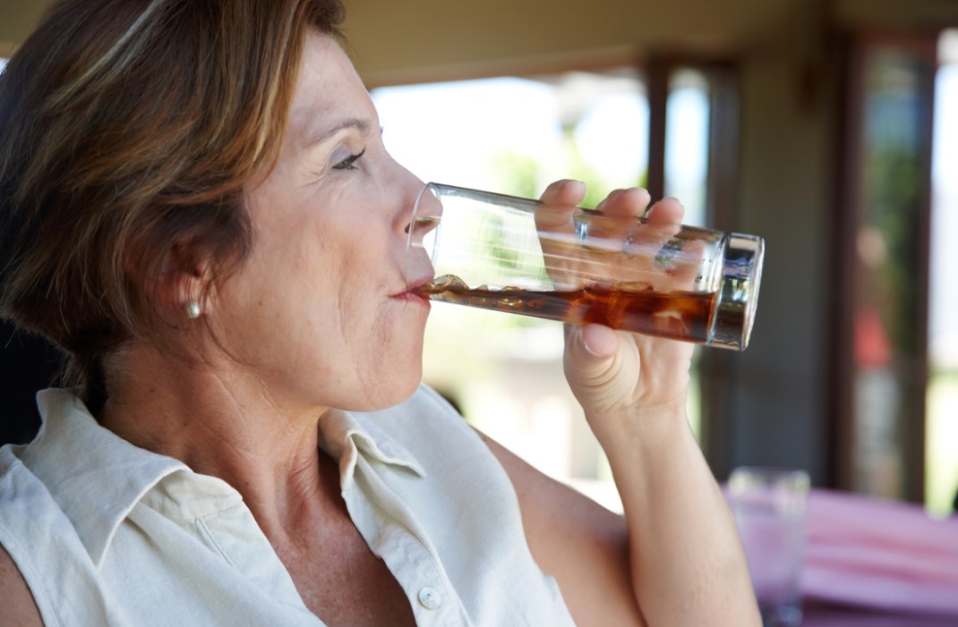 Woman drinking soda.