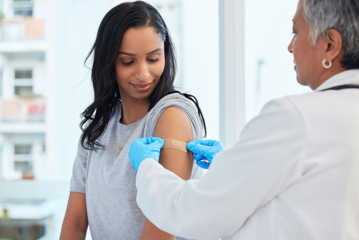 A woman gets a vaccine