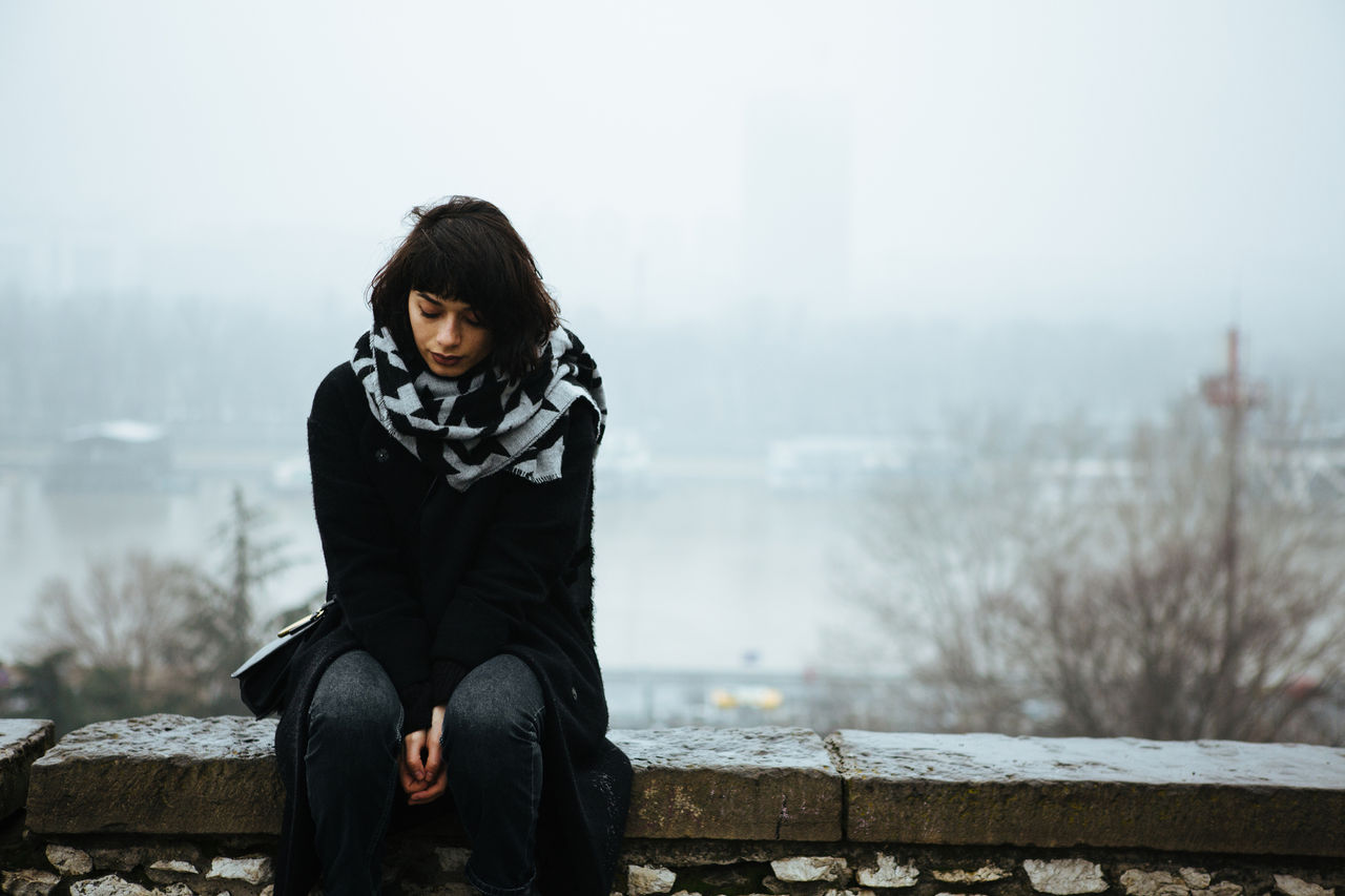 Woman looks sad in winter setting