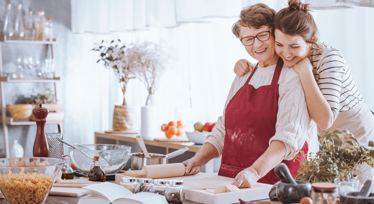 A mother and daughter baking for the holidays