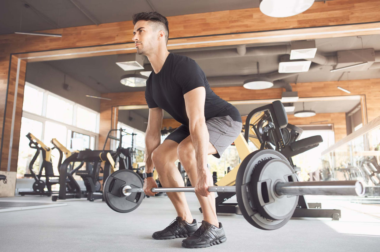 A male athlete practices weightlifting