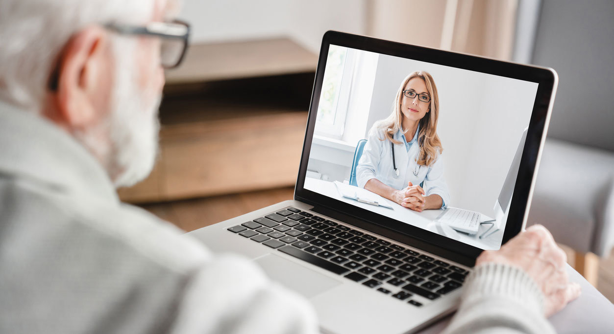 Patient talks to a health care provider on a laptop.