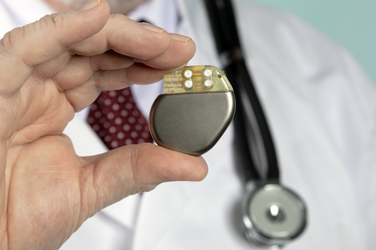 A doctor holding a leadless pacemaker