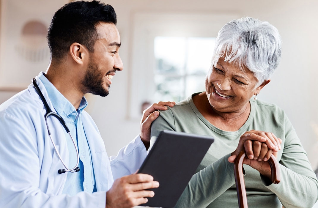 A team of providers coordinating care for a patient in a hospital.