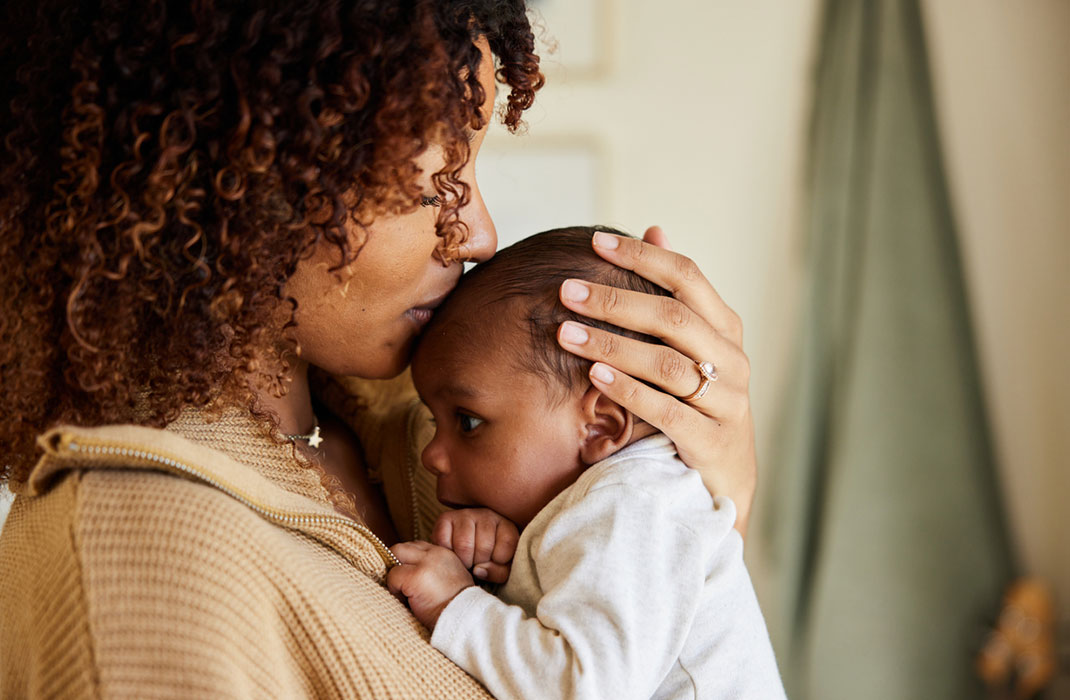 mom holding baby
