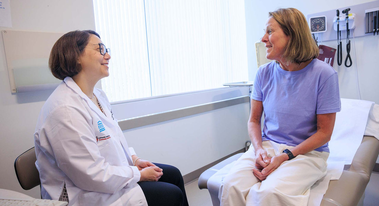 A patient and doctor review a lung scan