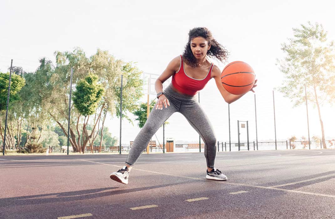 A woman playing basketball