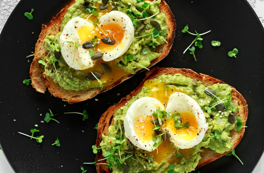 Soft-boiled eggs on avocado toast.