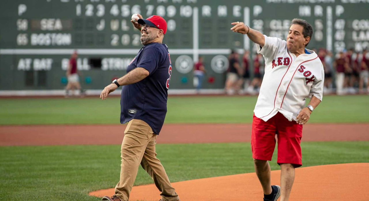Chuck Samiotes and his cardiac surgeon, Dr. Eriberto Michel, throwing out the ceremonial first pitch at a Boston Red Sox game.