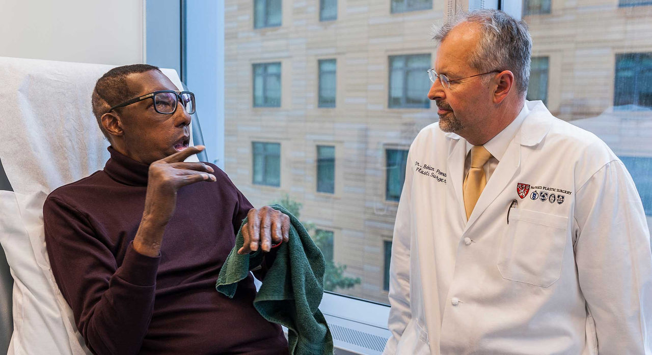 Dr. Pomahoc and face transplant patient Robert Chelsea.