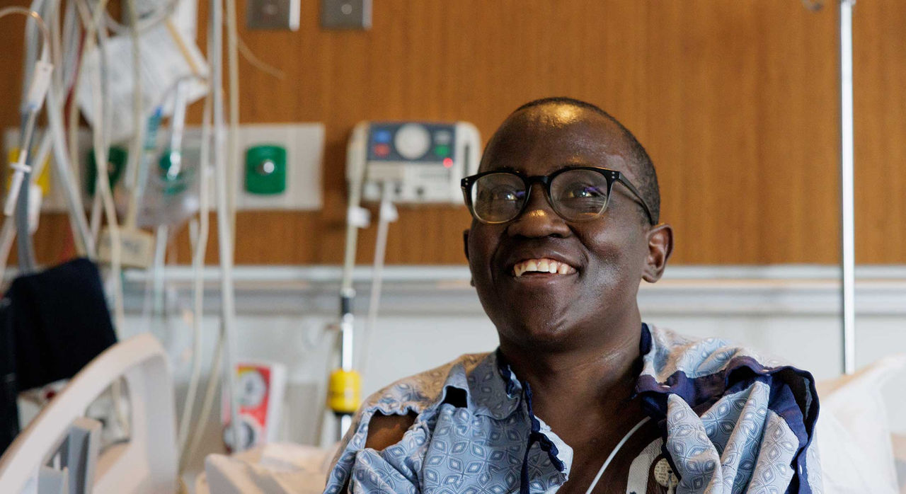 Allan smiling from his hospital bed.