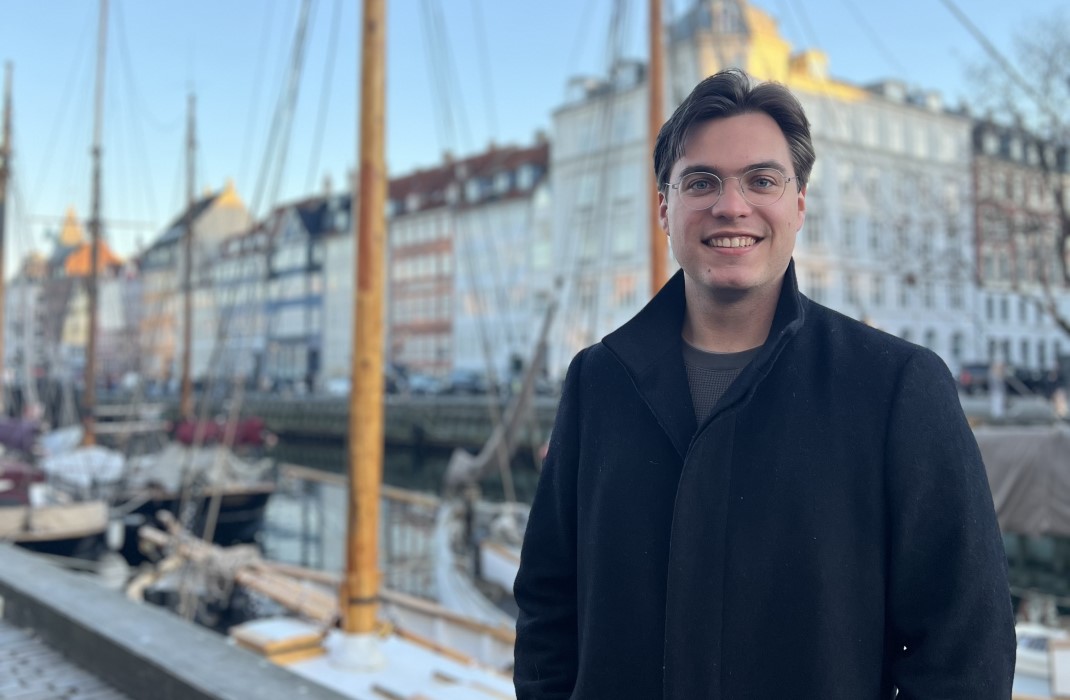 Michael Montague standing in front of boats