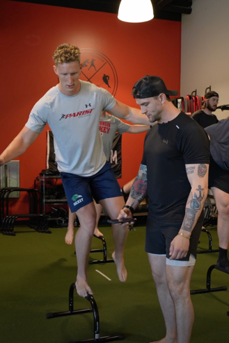Jack working on strength training with friend and strength coach Jeff LoVecchio, a retired pro hockey player.
