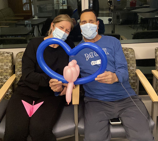 Jimmy and his wife, Lisa, with balloons and origami
