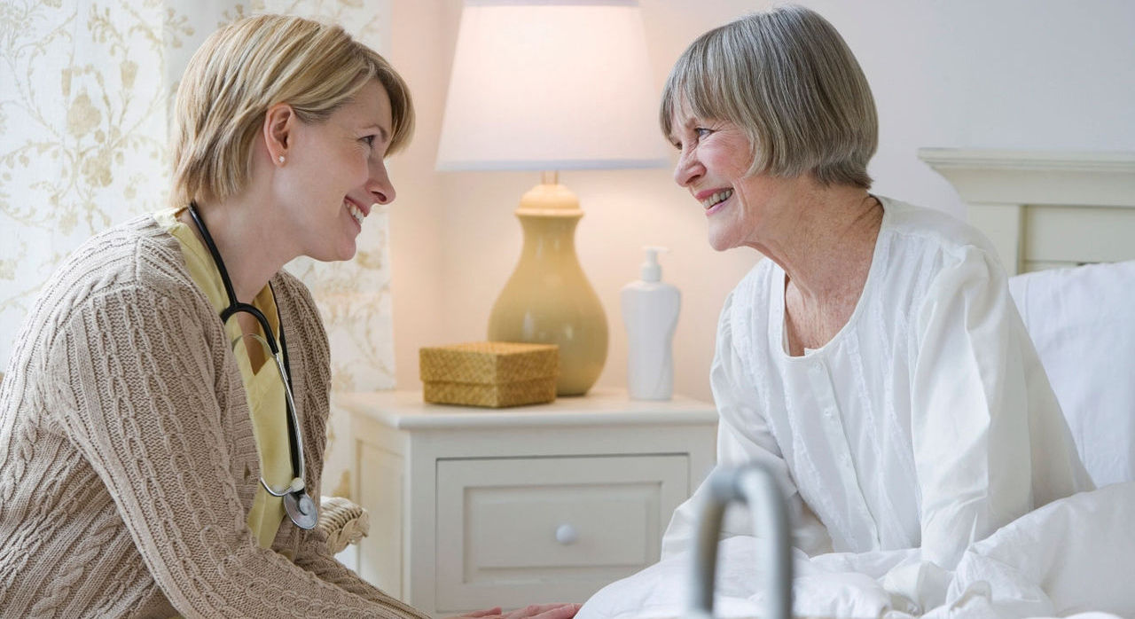 female home care provider with elderly patient