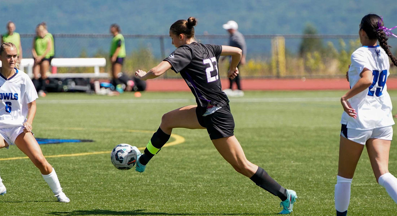 Kaylin O'Meara controlling the ball during a soccer match.