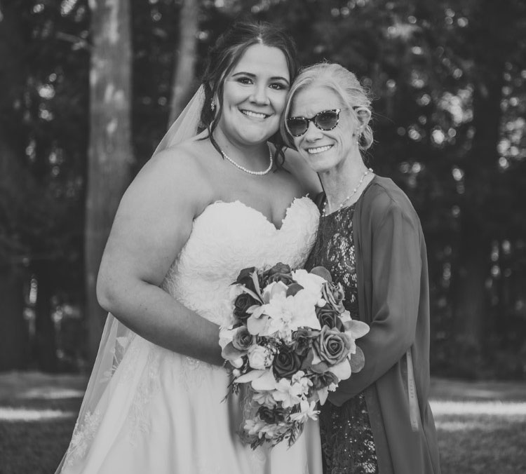 Kimmer Wright standing beside her daughter, Ashton