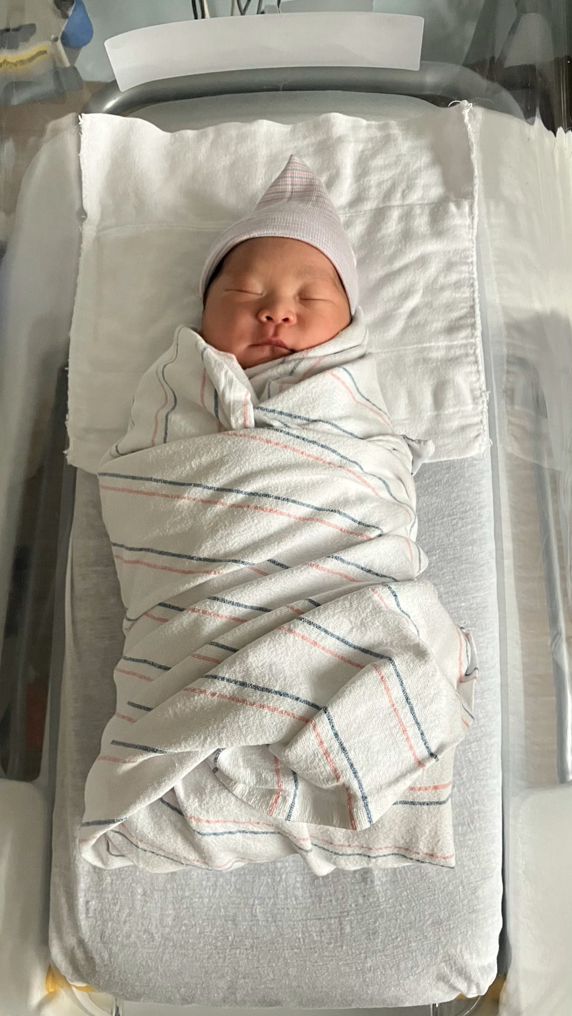 Baby Ben wrapped in a blanket.