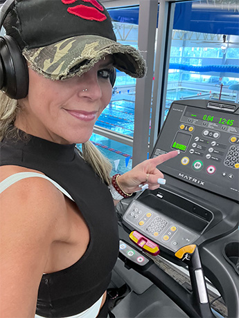 Tara in exercise gear on a treadmill