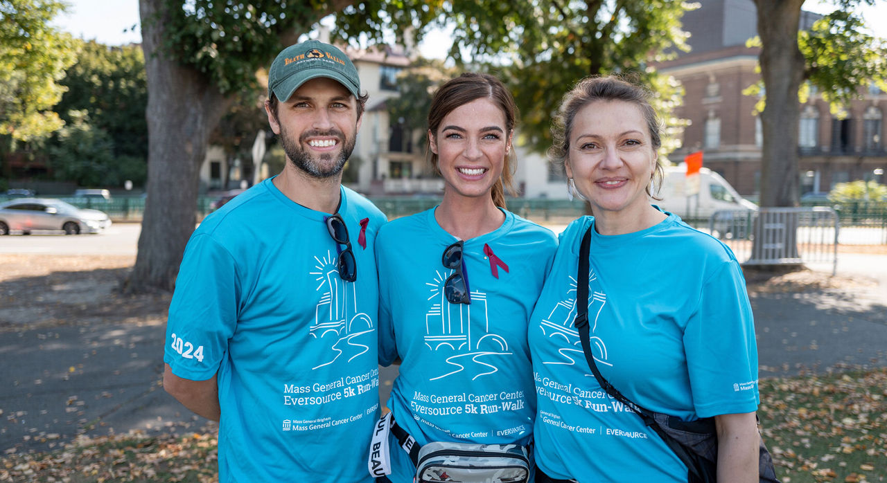 Tess (center) with her husband and Mass General Brigham oncologist, Diana Cirstea, MD
