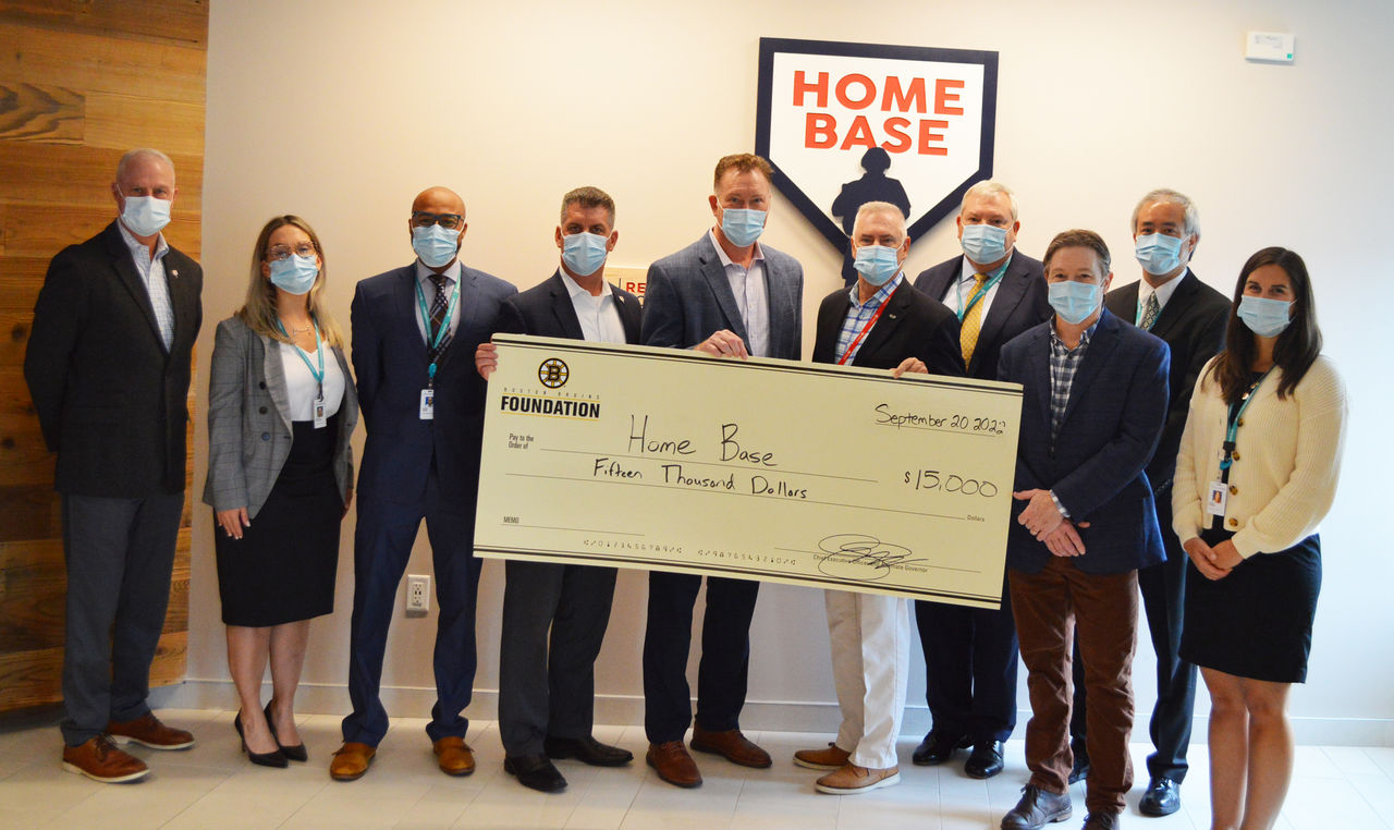 Group photo of Bruins donation to Home Base