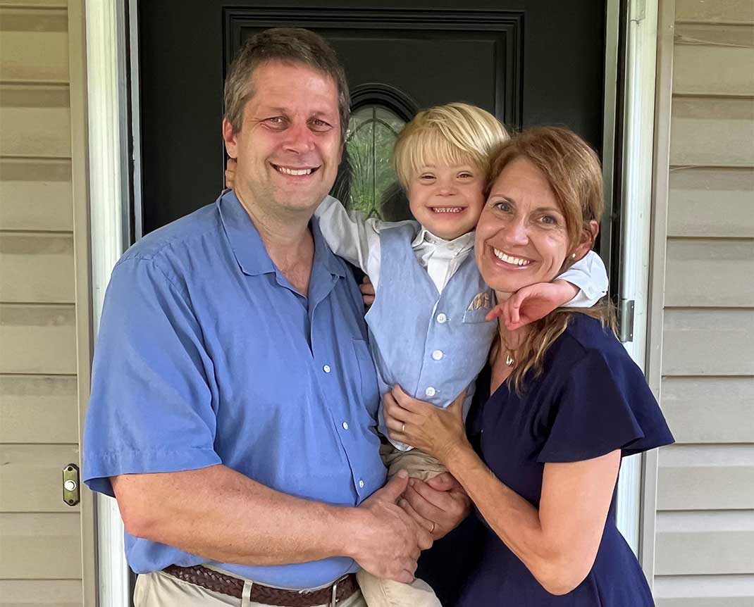 Four-year-old Theo Scott and his parents.