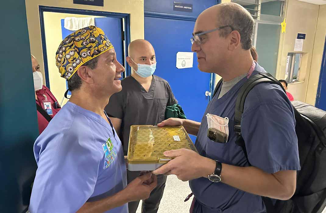 One physician gifts a surgical equipment kit to another physician