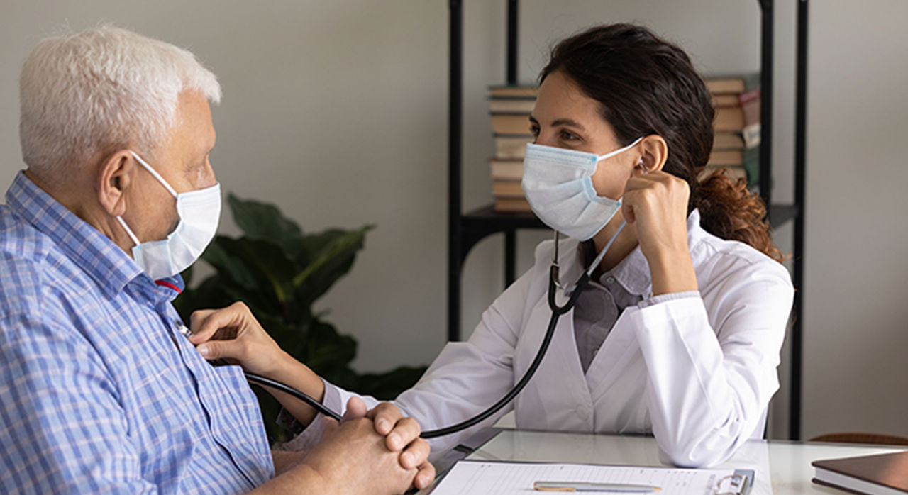 older man with healthcare worker