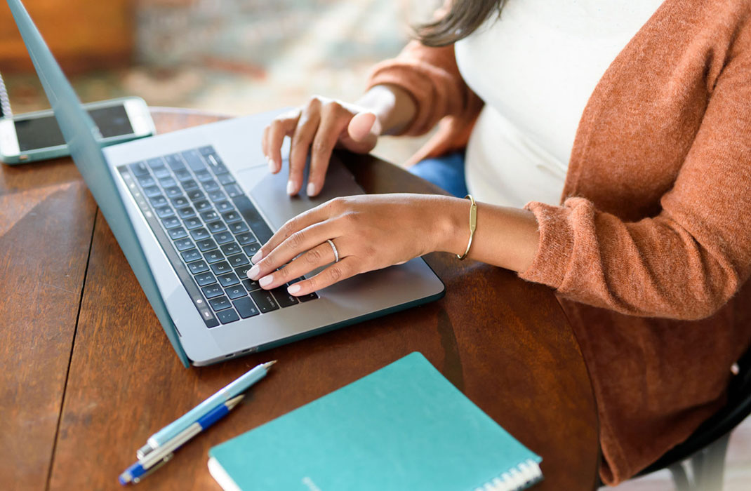 Woman uses laptop