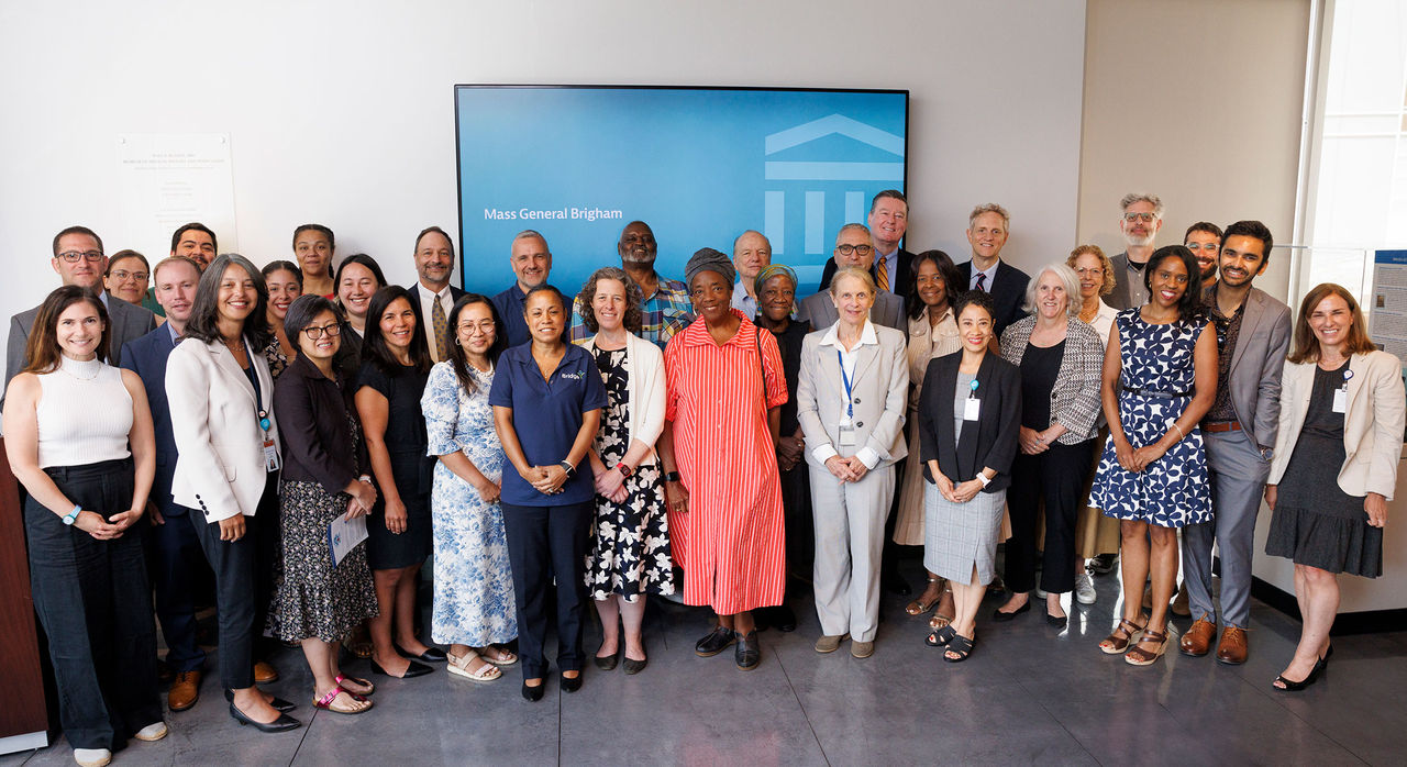 Recipients of Mass General Brigham’s housing grants pose with legislators and MGB leadership during today’s press conference.