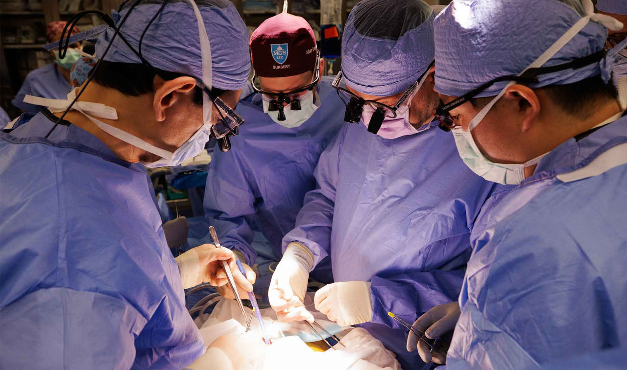 surgical team performing transplant in the operating room