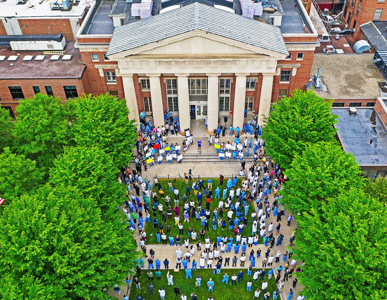 Staff and clinicians hold a vigil for George Floyd in front of Brigham and Women’s Hospital. 
