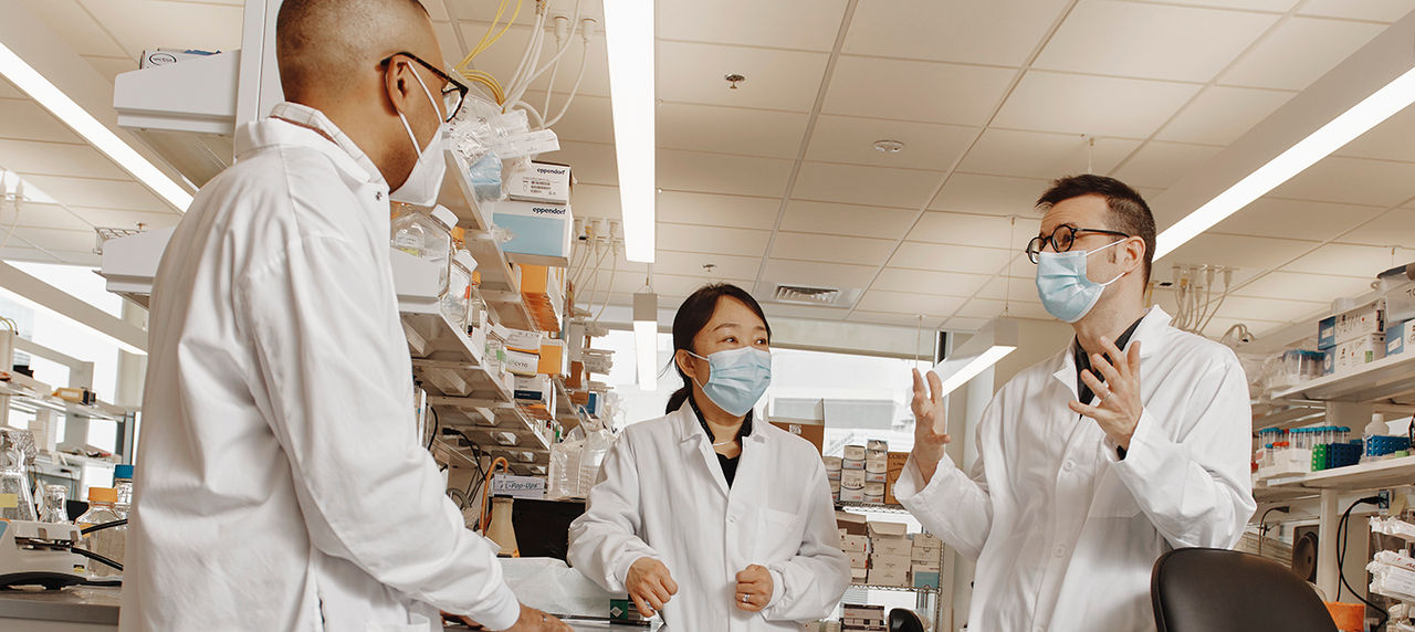 group of providers wearing masks and lab coats