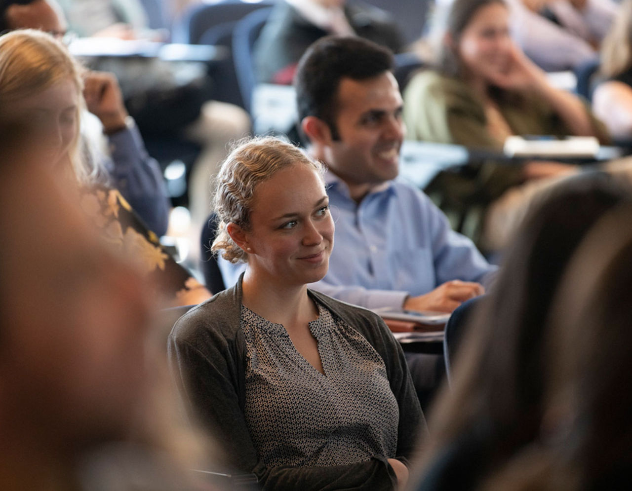 trainees in audience during a meeting