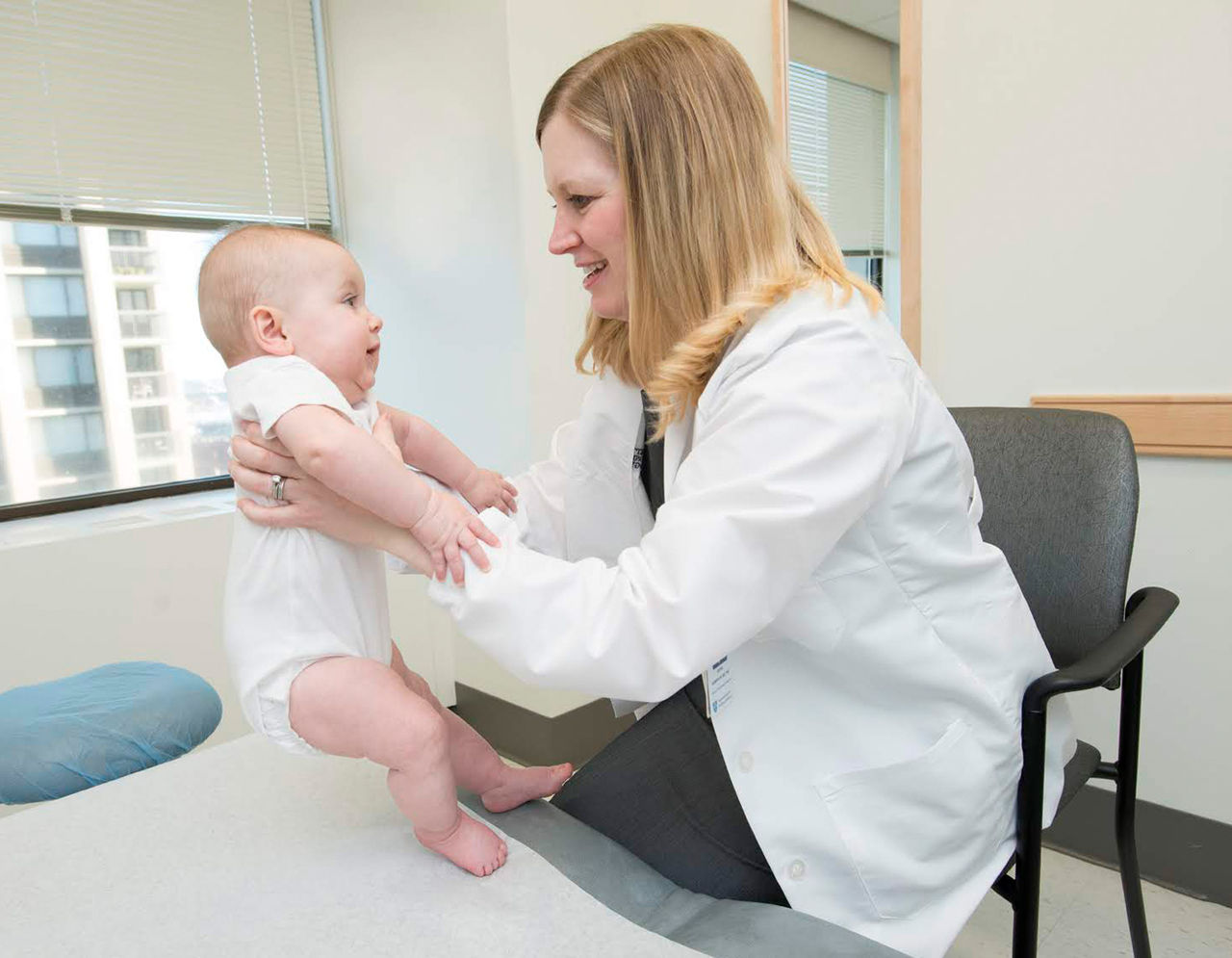 Dr. Elena Hawryluk with a pediatric patient