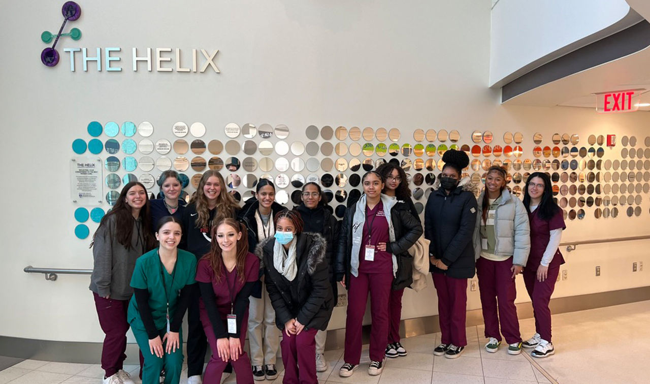 group of students posing in hallway