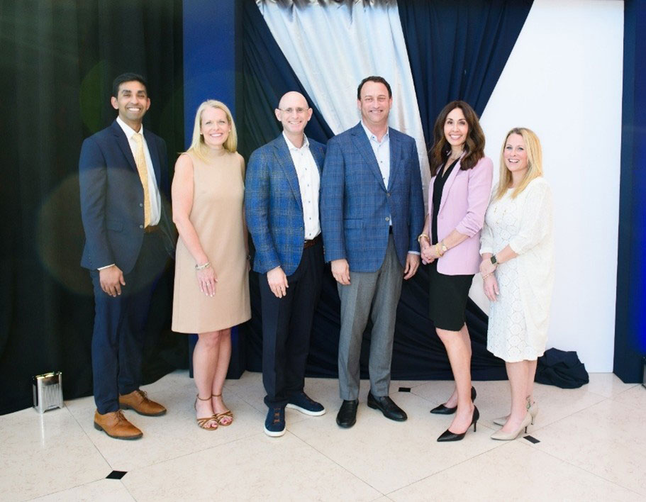 Mass General Brigham leaders attend Tampa General Hospital’s 2025 Power of Academic Medicine event. From Left to Right: Shyam Tanguturi, MD, Lindsay Gainer, Abraham Schwarzberg, MD, John Couris, Susan Fahmy, Nicole Keefe